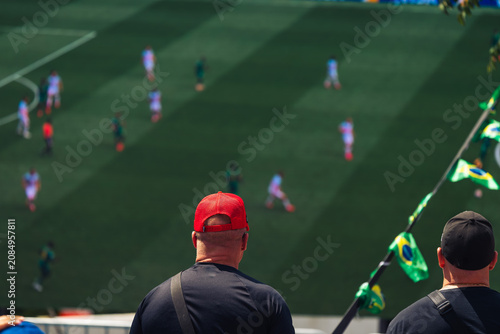 people watching a football match outside