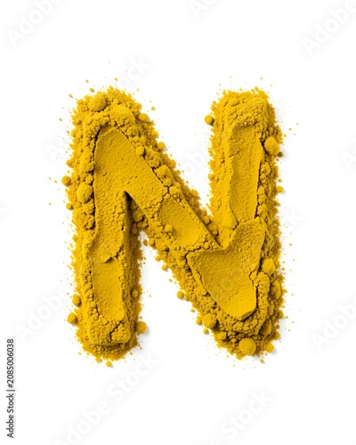 Yellow powder is stacked in the shape of an alphabet N on the floor.