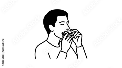 Foto Close-up of a man playing the harmonica instrument.