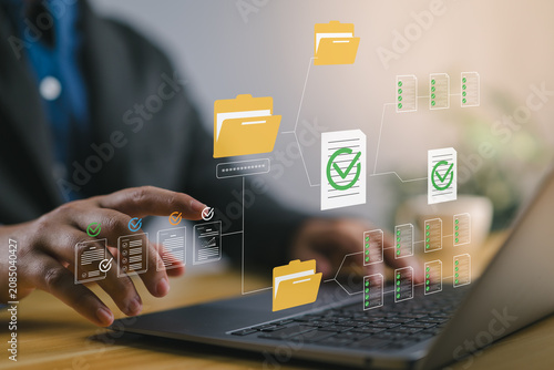 Secure digital document management system with password protected folders and encrypted file access on laptop used by businessman to ensure data safety, organization and workflow efficiency