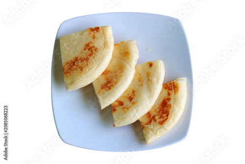 Sliced Flatbread or Naan Roti Served on a White Plate