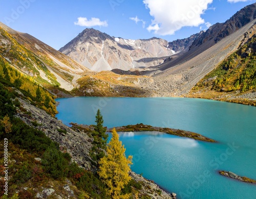 Mountain Lake Shavlinskoye in Altai in summer, view from a drone