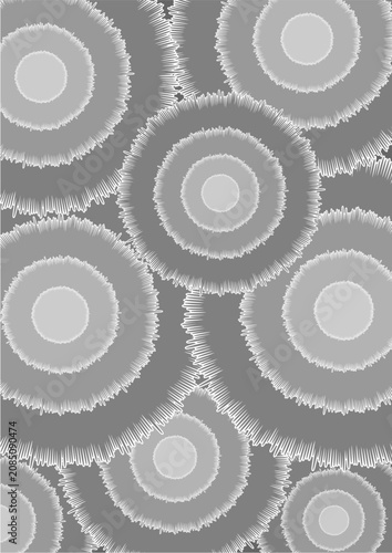 Abstract gray circular pattern featuring layered concentric rings with textured edges, forming a seamless geometric background with depth, repetition, and modern visual appeal.