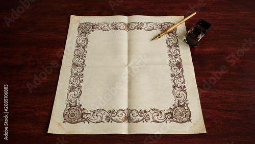 Vintage blank parchment paper with ornate floral borders and ink pen