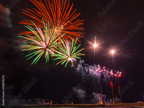 Photography Fireworks on the beach in Barcelona. An autumn night.