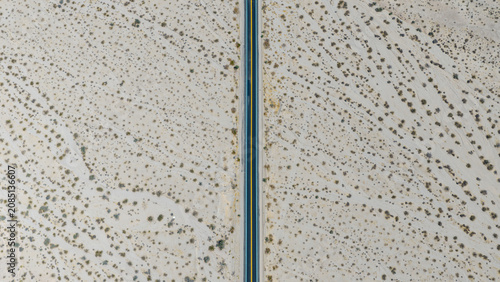 Canvastavla Aerial Top-Down View of Lone Desert Road Cutting Through Vast Arid Scrubland in
