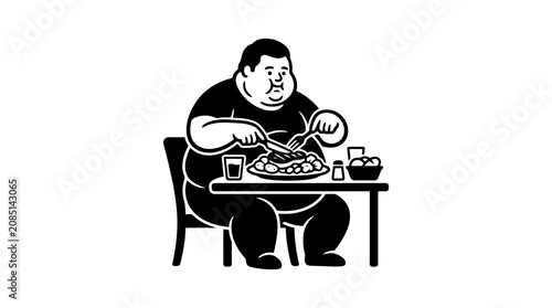 man sitting eating a large meal.