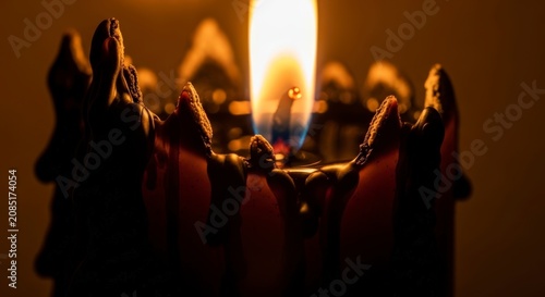 Buddhist monks praying with candles.