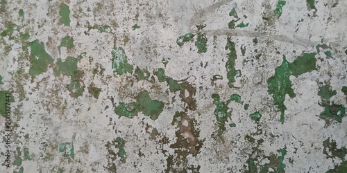 Фотография Abstract texture of aged wall with chipped green paint concrete weathered distre