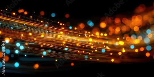 Abstract flow of glowing orange and blue particles on black background