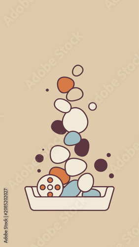 Stack of colorful smooth stones and film reel in a tray