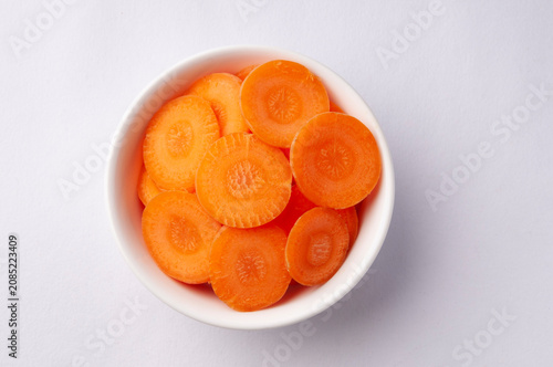 Sliced raw carrots as an ingredient in a salad or soup