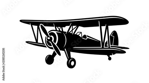 Bild auf Leinwand Silhouette of a vintage biplane airplane flying