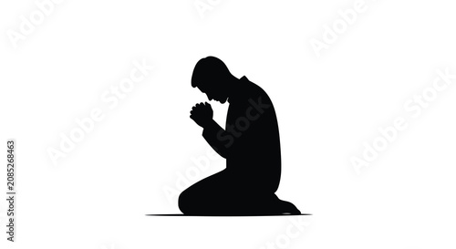 Fotografija Kneeling man in prayer pose a stark black silhouette against a white background