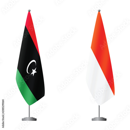 Obraz na plátně Libya and Indonesia flags on flagpoles for official ceremonies and meetings, tra