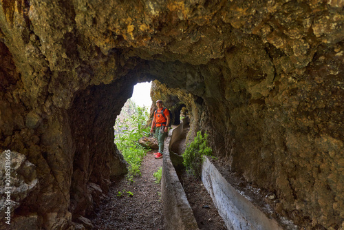 Hiker inside a canal tunnel