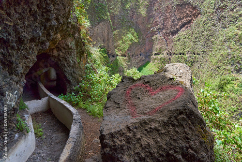 Painted heart on canal path rock