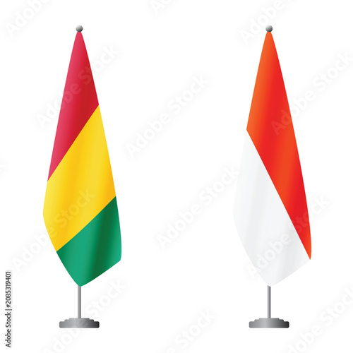 Foto Guinea and Indonesia flags on flagpoles for official ceremonies and meetings, tr