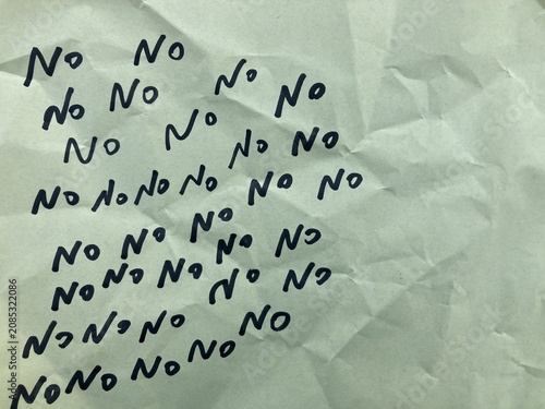 Photos word No written on wrinkled paper, handwritten text, The answer yes is written i