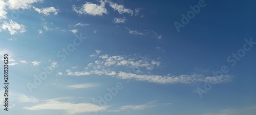 Bild auf Leinwand Beautiful bright blue sky with scattered light white cumulus and altocumulus clo
