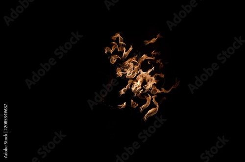 Tableau sur toile Fire flames isolated on black background – Fire Show performance, scattered burn