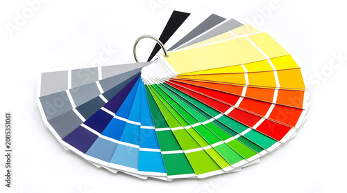 Color swatch fan deck with various hues on white background