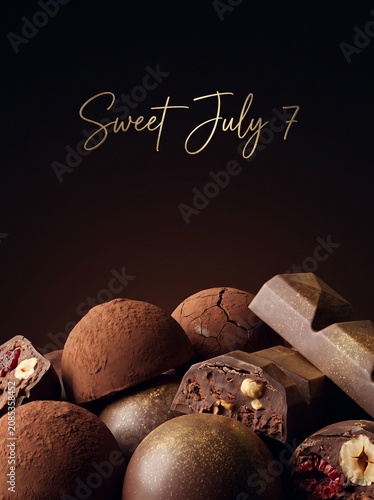 Assorted chocolate truffles and bars with sweet july seven text