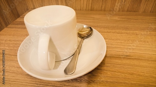 White Coffee Cup on Wooden Table With Copy Space