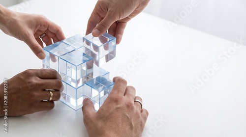 Hands Building Structure with Transparent Cubes Concept