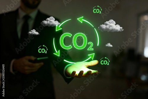 Businessman with CO2 Cycle Hologram