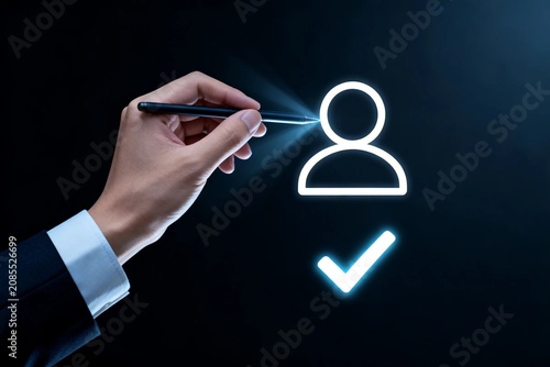 Business hand with glowing user icon and checkmark