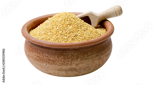 Canvastavla Clay pot filled with millet seeds and wooden scoop