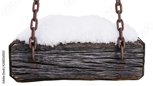 Rustic wooden sign covered in snow with rusty chains