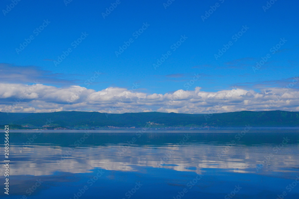 Fototapeta premium The village of Slyudyanka on Lake Baikal. A village on Lake Baikal. Slyudyanka