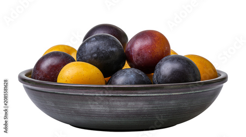 Tableau sur toile Dark ceramic bowl filled with ripe plums and yellow mirabelle plums