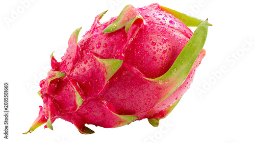 Pink dragon fruit with green leaves and water droplets