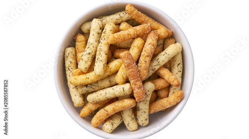 Fotografie Crunchy savory snacks with herbs in a white bowl