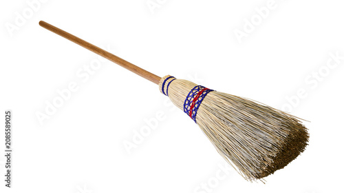 Tableau sur toile Natural straw broom with wooden handle and blue red binding