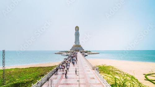 Timelapse of tourists moving around the Sea-based Guanyin statue in Sanya, Hainan Island, China.