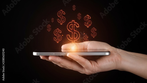 Human hand holding smartphone with glowing digital dollar signs above the screen
