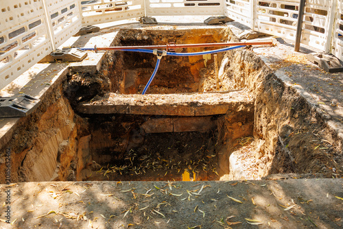 Large road excavation for underground utility infrastructure repair