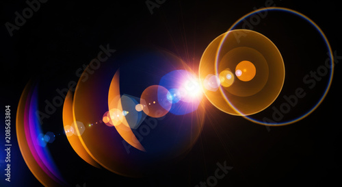 Multiple concentric circles radiate outward from a central bright point, creating a lens flare effect.