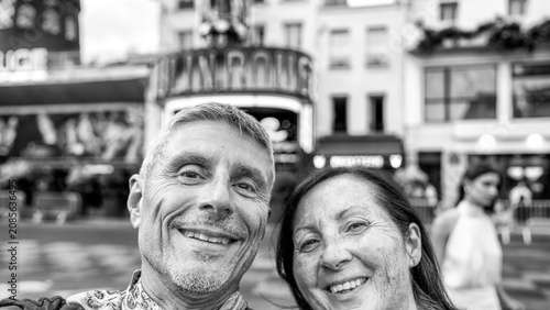 Fotografie Happy partners discovering Pigalle urban area in Paris.