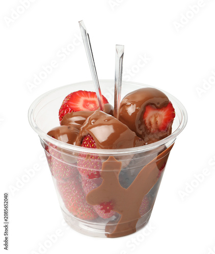 Photos Chocolate covered strawberries in plastic cup isolated on white