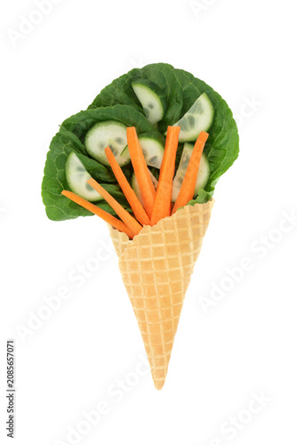 Surreal lettuce leaf cucumber carrot ice cream cornet fun whimsical diet concept design on white background. Healthy summer green organic vegetable food art.