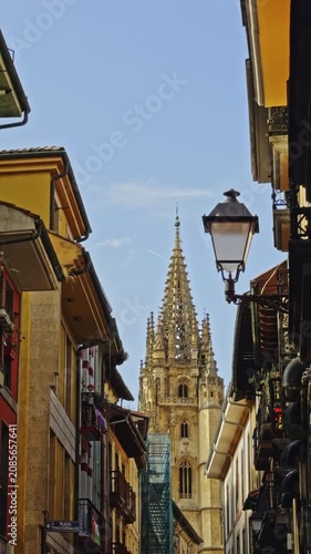 Cathedral spire above narrow street