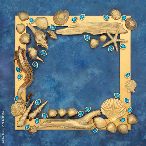 Gold objects and jewels nature border on mottled blue background. Luxury border decoration beautiful design for greeting card.
