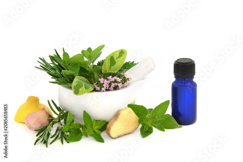 Natural hayfever sneezing remedy with herbs and spice. Medicinal herbal remedy, blue tincture oil bottle, on white. Antihistamine medicine for summer allergies.