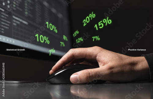 Hand computer mouse statistical growth positive variance percentage technology business finance data analysis digital interface close up of hand using computer mouse with floating green