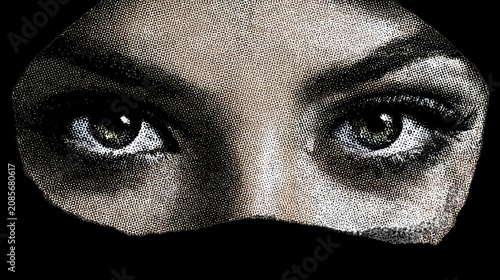 Mysterious Gaze: A close-up shot focusing on a woman's intense, kohl-lined eyes and dark hijab, hinting at mystery and unspoken stories.